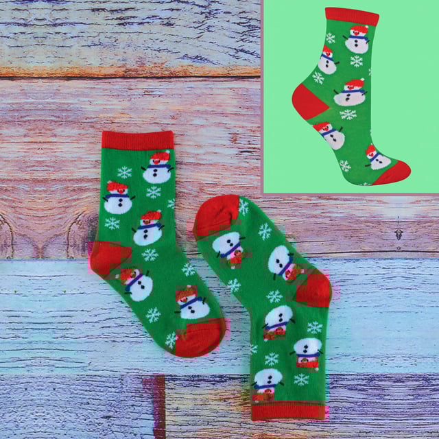 Are you in the middle of frantically buying presents for the Kids to stick in their Xmas stockings? Well these 4 Pairs of Kids Festive Christmas Socks can help you towards reaching that goal! With a very soft material and great breathability they’ll be sure to keep your littles ones feet comfortable no matter what they get up to during the festive season, especially on the madness that is Xmas Day. This pack of 4 Socks have 4 different funky and colourful designs on them which include: Christmas Puddings, Penguins, Snowmen & of course Santa Claus so the children will be spoilt for choice for their feet! They’re the ideal Christmas gift for your little ones or maybe even a great present for someone else's kids? They come in 3 different childrens sizes which are: 9-12 UK, 12-3 UK & 4-6 UK. They are also machine washable.