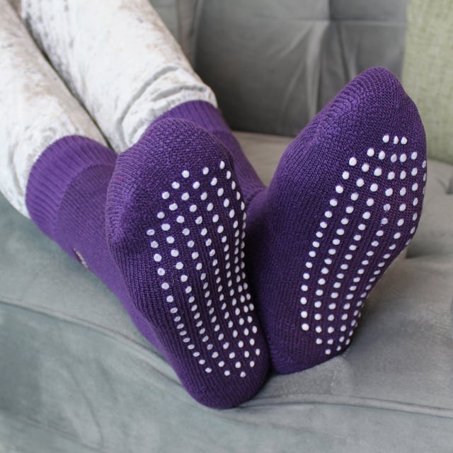 If you're looking for a slipper sock that's going to keep your little one's feet nice and cosy, look no further than THMO Kids Thermal Slipper Socks. The perfect pair to keep them warm while playing indoors. These socks have a stretchy comfort top that moulds to their leg to reduce constriction rings and tightness, which allows for regular circulation. As well as all day comfort, these socks feature a cushioned foot bed providing feet with an extra layer of support. They have been double brushed on the inside to maximise warmth by trapping warm air and keeping it close to their feet and legs. This inner brushing also softens the inside of the sock making it a great choice for keeping them warmer for longer. These anti slip grippers have been designed to prevent you from slipping on surfaces such as hard wooden floors or kitchen tiles. The dotted design on the foot of the sock is simple but effective. Perfect when they’re playing around the house. These Children’s Thermal Socks come in 4 colour options: Black, Navy, Fuchsia, Purple. They also come in 3 kids size options: 9-12 UK, 12-3 UK and 4-5.5 UK, The THMO badge is also heat transferred onto the side of the socks. These socks come in 4 different colours and are made from 93% Acrylic, 6% Polyamide, 1% Elastane. They are available in 3 Children’s sizes 9-12 UK(27-30 EUR 10-1 US), 12-3 UK (30-36 EUR, 13-4 US) and 4-5.5 UK(37-38.5 EUR, 5-6.5 US). They are machine washable at 40.