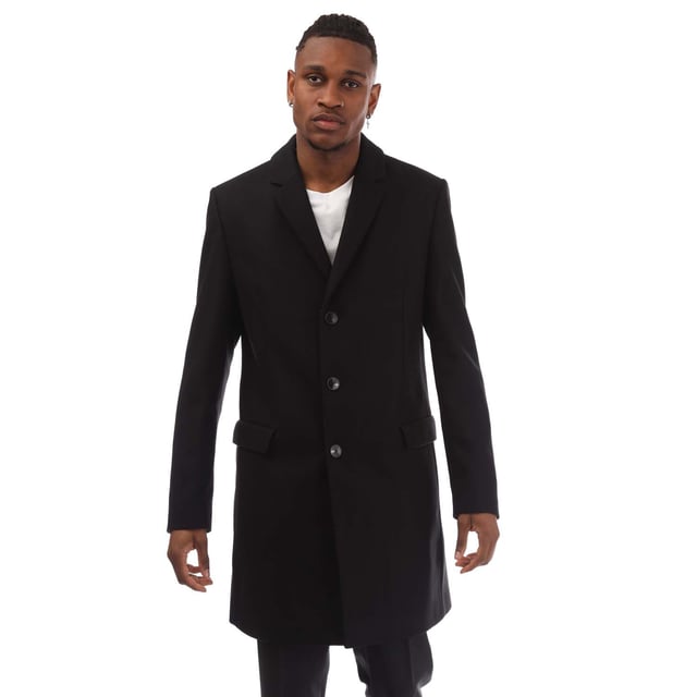 Mens HUGO Migor1841 Coat in black.- Notch lapels.- Welt pockets.- Inside zip pockets.- Kissing buttons on the cuff.- Back vent.- Fully lined.- Regular fit.- 80% Wool  20% Polyamide.- Ref: 50395949001