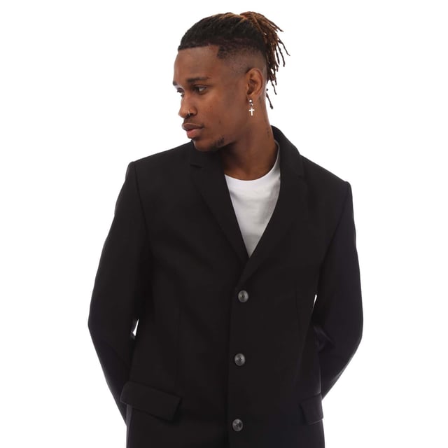 Mens HUGO Migor1841 Coat in black.- Notch lapels.- Welt pockets.- Inside zip pockets.- Kissing buttons on the cuff.- Back vent.- Fully lined.- Regular fit.- 80% Wool  20% Polyamide.- Ref: 50395949001