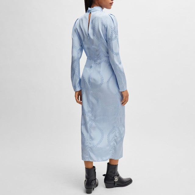 Women's Hugo Boss Kasera Dress. Feminine dress by HUGO Womenswear, crafted in fluent satin material with an all-over chain jacquard, a tie front and gatherings at the shoulders. This product is made with cellulose fibres, derived from natural raw wood material and sourced from responsibly managed forests.- Satin viscose fabric.- Regular fit.- Mock neck.- Long sleeves.- Asymmetric hem with front slit.- All-over chain jacquard pattern.- Unlined. Material: 100% Viscose. Ref: 50515220982.