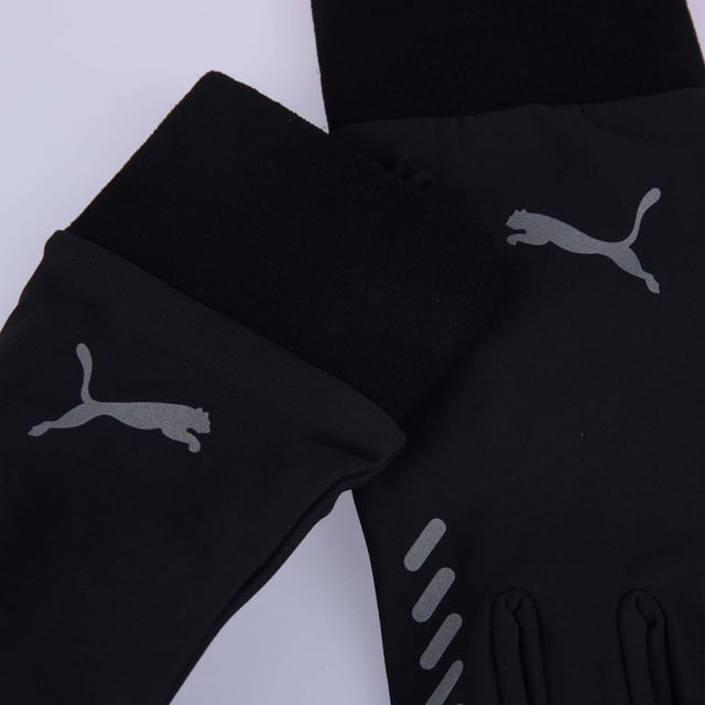 Puma Winter Gloves in black.- Soft  long wrist cuffs.- PUMA branding details.- Reflective decorative details.- Fingertips with smartphone function.- Silicone print on the inside of the palm indicates grip range.- Fleece lining.- 100% Cotton.- Ref: 4200401