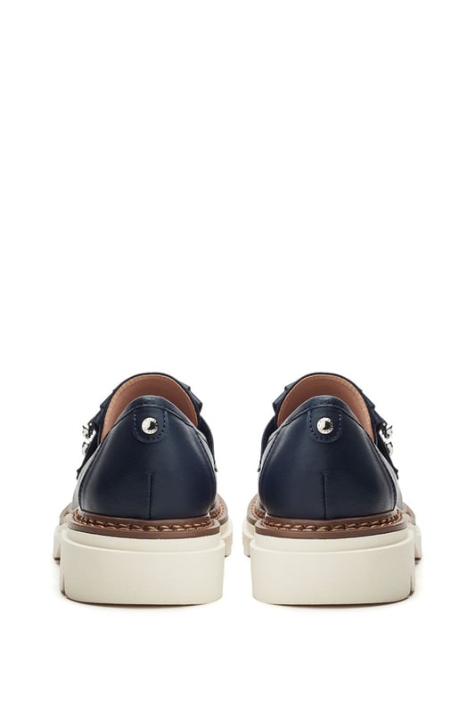 Dress to impress in Dallia, the chunky loafer with a cleated sole. This style features a classic snaffle trim for a sleek look with stitched detailing for a luxe feel. Complete with a leather sock for ultimate comfort.