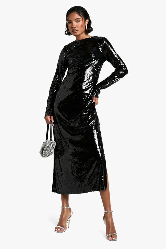 All-over sequin embellishment for maximum sparkle
        Flattering maxi length with side slit for ease of movement
        Long sleeves and crew neckline for a sophisticated silhouette
        Figure-hugging design accentuates curves
        Versatile style suitable for various festive occasions
    
    Make a dazzling entrance at your next Christmas soire with this show-stopping sequin maxi dress. The all-over embellishment catches the light beautifully, ensuring you'll be the centre of attention. Its figure-hugging silhouette and maxi length create an elegant, elongated look, while the side slit adds a touch of allure and allows for graceful movement. Perfect for festive celebrations, pair it with strappy metallic heels and a sparkly clutch for a glamorous ensemble. For a more understated look, layer with a faux fur stole and opt for minimal jewellery to let the dress do the talking. Whether you're attending a Christmas party or planning your Christmas Day outfit, this versatile piece will have you looking and feeling fabulous throughout the festive season.