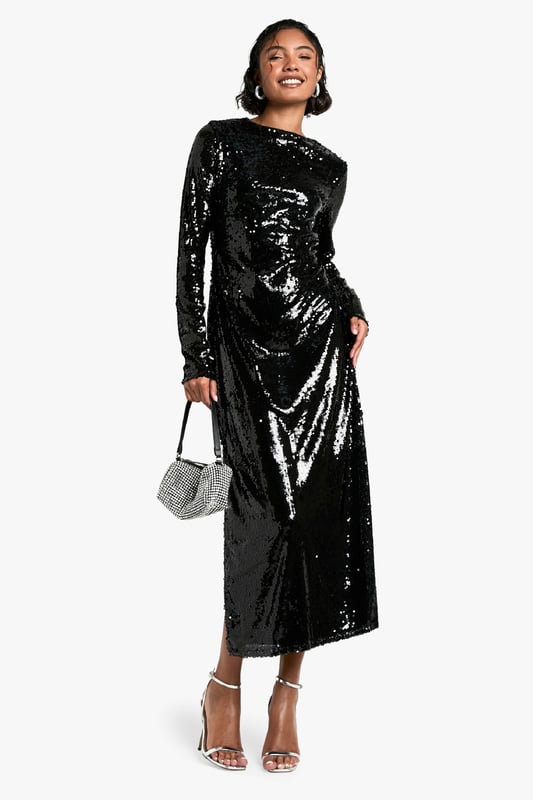 All-over sequin embellishment for maximum sparkle
        Flattering maxi length with side slit for ease of movement
        Long sleeves and crew neckline for a sophisticated silhouette
        Figure-hugging design accentuates curves
        Versatile style suitable for various festive occasions
    
    Make a dazzling entrance at your next Christmas soire with this show-stopping sequin maxi dress. The all-over embellishment catches the light beautifully, ensuring you'll be the centre of attention. Its figure-hugging silhouette and maxi length create an elegant, elongated look, while the side slit adds a touch of allure and allows for graceful movement. Perfect for festive celebrations, pair it with strappy metallic heels and a sparkly clutch for a glamorous ensemble. For a more understated look, layer with a faux fur stole and opt for minimal jewellery to let the dress do the talking. Whether you're attending a Christmas party or planning your Christmas Day outfit, this versatile piece will have you looking and feeling fabulous throughout the festive season.