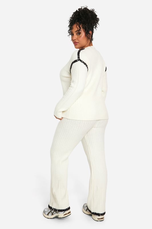 Cosy ribbed knit co-ord set for ultimate comfort
        Contrast trim detail adds a stylish edge
        Relaxed fit pullover with crew neckline
        Wide-leg trousers for a trendy silhouette
        Versatile two-piece ensemble for mix-and-match styling
    
    Embrace laid-back chic with this Plus Premium Pullover and Trouser set from Boohoo. The ribbed knit texture offers a tactile appeal while ensuring warmth and comfort for those casual days out. The contrast trim detail elevates the look, adding a contemporary twist to this cosy ensemble. Perfect for lounging at home or running errands, this co-ord set can be easily dressed up or down. Pair the pullover with your favourite jeans for a quick coffee run, or team the wide-leg trousers with a crisp white tee and trainers for a relaxed weekend look. For a complete outfit, throw on some statement earrings and a crossbody bag. This versatile set is a must-have for the fashion-forward woman who values both style and comfort in her everyday wardrobe.