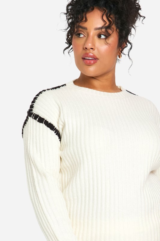 Cosy ribbed knit co-ord set for ultimate comfort
        Contrast trim detail adds a stylish edge
        Relaxed fit pullover with crew neckline
        Wide-leg trousers for a trendy silhouette
        Versatile two-piece ensemble for mix-and-match styling
    
    Embrace laid-back chic with this Plus Premium Pullover and Trouser set from Boohoo. The ribbed knit texture offers a tactile appeal while ensuring warmth and comfort for those casual days out. The contrast trim detail elevates the look, adding a contemporary twist to this cosy ensemble. Perfect for lounging at home or running errands, this co-ord set can be easily dressed up or down. Pair the pullover with your favourite jeans for a quick coffee run, or team the wide-leg trousers with a crisp white tee and trainers for a relaxed weekend look. For a complete outfit, throw on some statement earrings and a crossbody bag. This versatile set is a must-have for the fashion-forward woman who values both style and comfort in her everyday wardrobe.