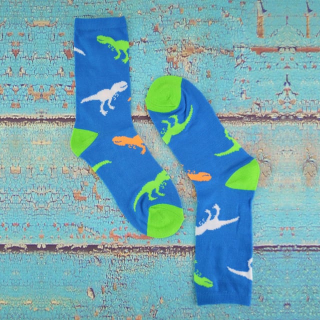 Boys will be boys, love pulling faces and love dinosaurs! So now they’ve got some funky socks to go with them, Socks with faces and dinos on! So consider these socks as part of their outfit to keep them ever young and innocent. With a soft polyester material these socks will be sure to keep your kids feet comfortable throughout the day. One pack comes with two funny faces and the other pack comes with colourful printed designs of their favourite dinosaurs, including T-Rex! Ideal for lasting all day while they’re out playing and being themselves. They are a great novelty gift for your boys or even a gift for your friends' boys? Bright, vibrant and loads of fun. Especially if they love pulling faces or playing as their favourite dino! These socks come in a 6 pair pack, have 3 sizes available: 9-12, 12-3 & 4-6 UK, are 98% Polyester 2% Elastane and they are also machine washable
