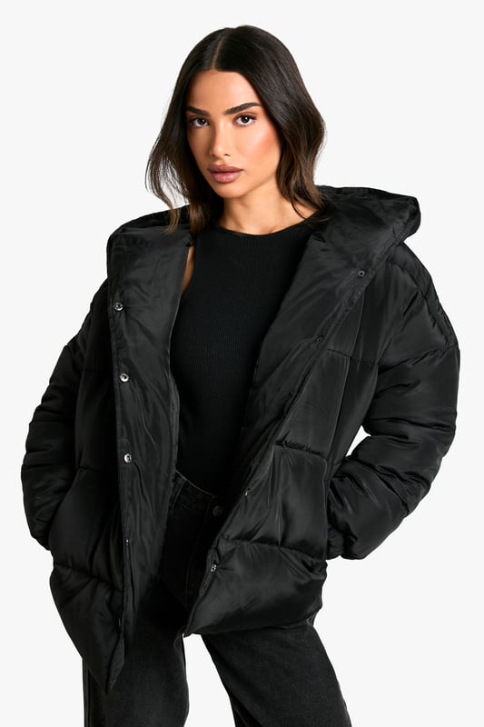 Cosy hooded design for extra warmth and style
        Padded construction offers superior insulation
        Oversized fit for a trendy, relaxed silhouette
        Front button closure for easy wear
        Versatile petite sizing for a perfect fit
    
    Embrace the chill with this must-have Petite Hooded Padded Coat from Boohoo. This versatile piece combines comfort and style, making it perfect for your casual outings. The oversized silhouette allows for effortless layering, while the padded construction ensures you stay snug in cooler temperatures. Style it with wide-leg trousers and trainers for a laid-back look, or pair it with skinny jeans and ankle boots for a more polished ensemble. Whether you're heading to a family gathering or meeting friends for a coffee, this coat will keep you looking fashionable and feeling cosy. Its adaptable nature makes it an ideal choice for various casual occasions, from weekend errands to relaxed evening walks. The petite sizing ensures a flattering fit for smaller frames, proving that fashion-forward outerwear isn't just for the tall.