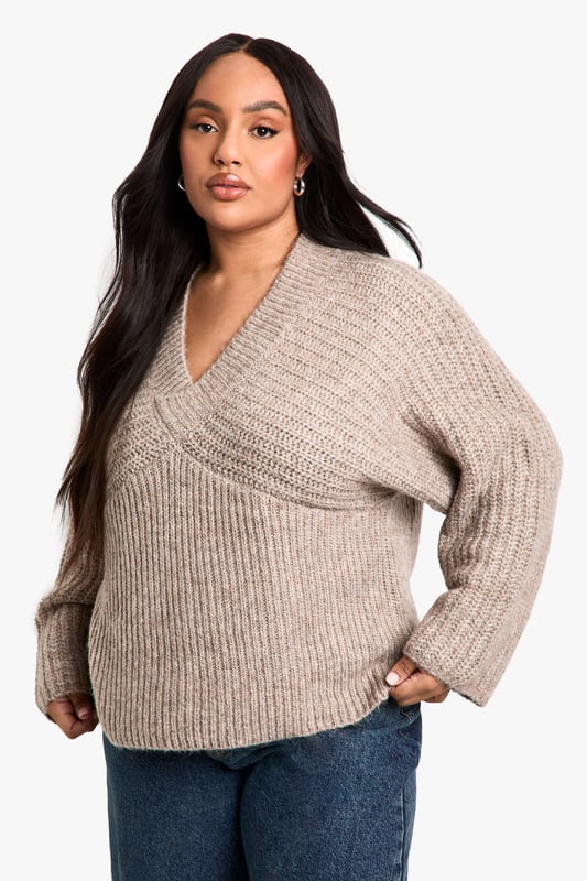 Ribbed texture for added visual interest
        V-neckline for a flattering silhouette
        Wide sleeves for a relaxed, comfortable fit
        Cropped length perfect for layering
        Versatile design suitable for various casual occasions
    
    Embrace comfort and style with this plus-size ribbed V-neck jumper. The wide sleeves offer a trendy, relaxed look while the cropped length adds a contemporary touch to your wardrobe. Perfect for those laid-back days, this jumper can be easily styled for various casual events. Pair it with high-waisted jeans and trainers for a quick coffee run, or dress it up with wide-leg trousers and statement earrings for a family gathering. The ribbed texture adds depth to your outfit, making it an ideal choice for transitional weather. Whether you're lounging at home or meeting friends for a casual lunch, this jumper provides the perfect blend of cosiness and chic appeal. Its versatility allows for effortless styling, making it a must-have addition to your everyday wardrobe.