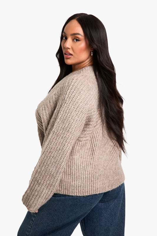 Ribbed texture for added visual interest
        V-neckline for a flattering silhouette
        Wide sleeves for a relaxed, comfortable fit
        Cropped length perfect for layering
        Versatile design suitable for various casual occasions
    
    Embrace comfort and style with this plus-size ribbed V-neck jumper. The wide sleeves offer a trendy, relaxed look while the cropped length adds a contemporary touch to your wardrobe. Perfect for those laid-back days, this jumper can be easily styled for various casual events. Pair it with high-waisted jeans and trainers for a quick coffee run, or dress it up with wide-leg trousers and statement earrings for a family gathering. The ribbed texture adds depth to your outfit, making it an ideal choice for transitional weather. Whether you're lounging at home or meeting friends for a casual lunch, this jumper provides the perfect blend of cosiness and chic appeal. Its versatility allows for effortless styling, making it a must-have addition to your everyday wardrobe.