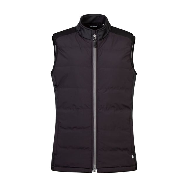 Chaleco híbrido impermeable y de peso medio para mujer de Heat Holders®: Bienvenido al chaleco híbrido de peso medio y resistente al agua de Heat Holders®, ¡la elección definitiva para el confort invernal! Con su característico forro HeatWeaver®, el calor aumenta con cada uso. Con un peso medio, está hábilmente diseñado para combatir el frío al tiempo que garantiza un confort superior. Ya sea una tarde lluviosa o una mañana helada, la capa exterior resistente al agua garantiza tu comodidad. Nuestro chaleco Hybrid es una obra maestra. Los paneles laterales de forro polar elástico contribuyen a un confort insuperable y a un ajuste perfecto, permitiéndote moverte con libertad y confianza. Los bolsillos laterales con cremallera bien diseñados y los bolsillos interiores adicionales lo hacen superpráctico, ayudándote a proteger tus objetos de valor mientras mantienes las manos libres. Disponible exclusivamente en el versátil tono negro, el chaleco Ladies Heat Holders® Hybrid Gilet es un gran complemento para tu armario de invierno. Asegúrese de consultar nuestra guía de tallas antes de la compra, ya que le garantiza un ajuste perfecto. Confeccionado en 100% poliéster en toda la prenda -piel, forro y relleno-, este chaleco ofrece la combinación ideal de durabilidad, flexibilidad y calidez. Y cuando se trata de su mantenimiento, es tan sencillo como meterlo en la lavadora a 40 °C. Sólo recuerda, nada de secadora. Recuerda, nada de secadora. Aumenta tu confort invernal con este chaleco Heat Holders®.