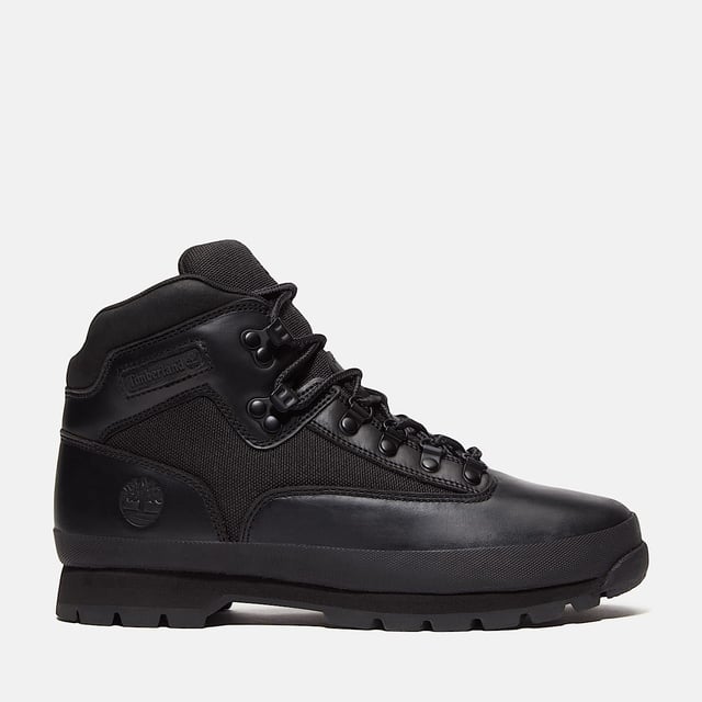 Hiking boots crafted with premium Timberland® leather and canvas upper, cushioned EVA footbed, and ReBOTL™ fabric lining made from at least 50% recycled PET plastic. Durable rubber lug outsole for enhanced traction.