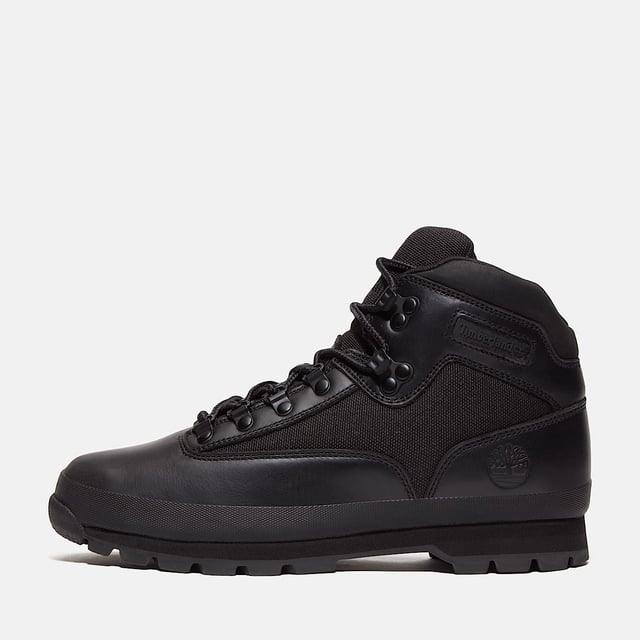 Hiking boots crafted with premium Timberland® leather and canvas upper, cushioned EVA footbed, and ReBOTL™ fabric lining made from at least 50% recycled PET plastic. Durable rubber lug outsole for enhanced traction.