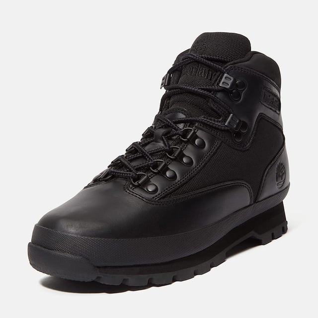 Hiking boots crafted with premium Timberland® leather and canvas upper, cushioned EVA footbed, and ReBOTL™ fabric lining made from at least 50% recycled PET plastic. Durable rubber lug outsole for enhanced traction.