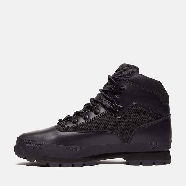 Hiking boots crafted with premium Timberland® leather and canvas upper, cushioned EVA footbed, and ReBOTL™ fabric lining made from at least 50% recycled PET plastic. Durable rubber lug outsole for enhanced traction.