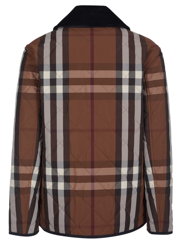 100% poliamida; Chaqueta Burberry Dranefeld;  Modelo: 8060487 1005;  Mano de obra de alta calidad;  Cuello Kent fabricado en pana;  Tapeta de botones con 5 broches a presión;  Tres bolsillos delanteros;  Acolchado con forro ligero;  Detalles del logotipo de Burberry