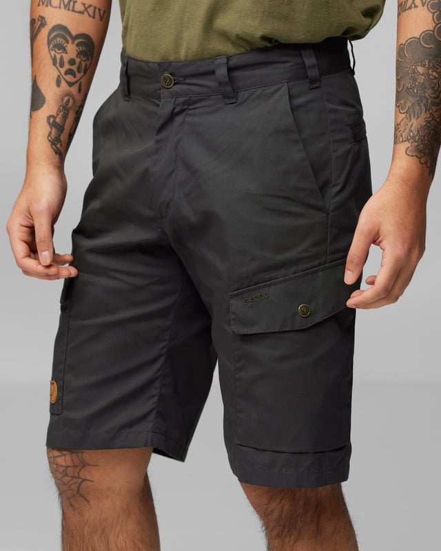 Men’s Ruaha Shorts M
Lightweight, sturdy travel shorts in G-1000 Lite. Practical for travel adventures and long trips when you need durable garments that can withstand harder wear. Roomy leg pockets with flaps, ergonomically placed on the side of the leg and with diagonal openings for better access. Two hand pockets and zippered back pockets that are hidden under a flap.

Travel shorts in hard-wearing G-1000® Lite.
Two hand pockets, two leg pockets, two welt pockets with hidden zippers and an inside safety pocket.
Inseam length 28 cm in size 48.
Adaptable with Greenland Wax, Durable, Quick-drying, Ventilation, Water resistant
Contains non-textile elements of animal origin.

Additional care instructions

40°C normal process
do not dry clean
do not tumble dry
do not bleach
iron 1 dot - Max 110°C
wash with similar colors, do not use fabric softener

Composition material

G-1000® Lite: 65% polyester (recycled), 35% cotton (organic)

Regular Fit
F81188
