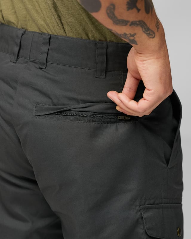 Men’s Ruaha Shorts M
Lightweight, sturdy travel shorts in G-1000 Lite. Practical for travel adventures and long trips when you need durable garments that can withstand harder wear. Roomy leg pockets with flaps, ergonomically placed on the side of the leg and with diagonal openings for better access. Two hand pockets and zippered back pockets that are hidden under a flap.

Travel shorts in hard-wearing G-1000® Lite.
Two hand pockets, two leg pockets, two welt pockets with hidden zippers and an inside safety pocket.
Inseam length 28 cm in size 48.
Adaptable with Greenland Wax, Durable, Quick-drying, Ventilation, Water resistant
Contains non-textile elements of animal origin.

Additional care instructions

40°C normal process
do not dry clean
do not tumble dry
do not bleach
iron 1 dot - Max 110°C
wash with similar colors, do not use fabric softener

Composition material

G-1000® Lite: 65% polyester (recycled), 35% cotton (organic)

Regular Fit
F81188