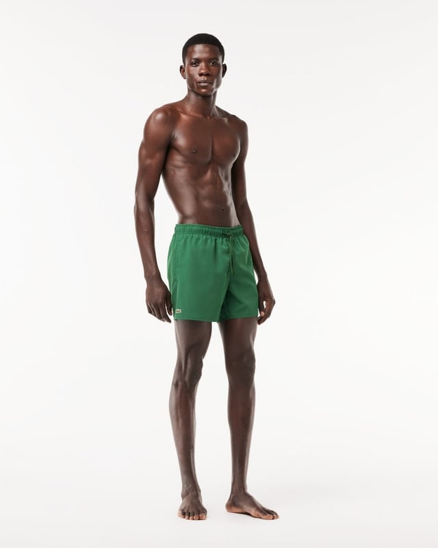 Step out of the water almost dry with these recycled quick-dry recycled polyester taffeta swim shorts. Loaded with practical features including two side pockets, mesh lining and a contrast drawstring. Your weekend getaway just got more exciting.
Light recycled quick-dry taffeta (smooth, very light weaved fabric with a slightly shiny finish)Side pocketsElasticised waistband with contrast drawstringMesh liningEmbroidered green crocodile on thighPolyester (100%)
MH6270