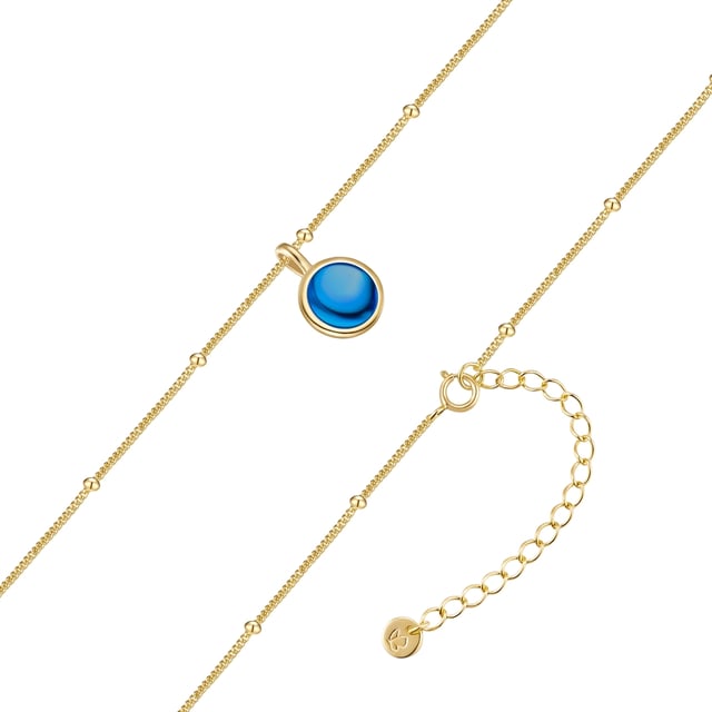 Discover the masterful elegance of this necklace from the Glanzstücken München brand! This delicate anchor chain, made from the finest 925 sterling silver and finished in shiny 14 carat yellow gold, gives every look a touch of luxury. The highly polished surface ensures a breathtaking shine, while the fine beads give the chain a playful touch. The blue cabochon-cut zirconia catches the light perfectly and becomes a sparkling highlight of your outfit. Thanks to an extension piece with a spring ring clasp, the length of the chain can be perfectly adjusted. Wear a piece of luxury and enchant your surroundings!