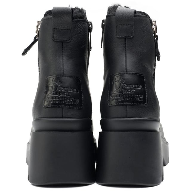 Embrace the seasonal changes in style and confidence with the Panama Jack Phuket ankle boots. These black Leather boots blend premium materials with a cleated, rugged rubber sole to provide a gripping, sturdy stride, whilst the block heel and raised sole give extra height. The cosy, cuddly faux fur plush lining keeps your feet warm on chilly days. Their contemporary design showcases a toggled zip with silver hardware and heel branding. These Panama Jack boots are your quintessential companion for a versatile, modern look.