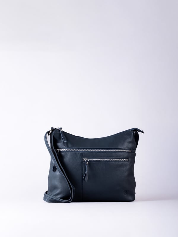 For sophisticated every day organisation, look no further than the Winleigh shoulder bag. Crafted from supple leather, this accessory wardrobe essential has a comfortable adjustable strap and pockets aplenty. In a classic navy colourway, this versatile bag will pair with all of your outfits no matter the season. Measurements: 36x24x14