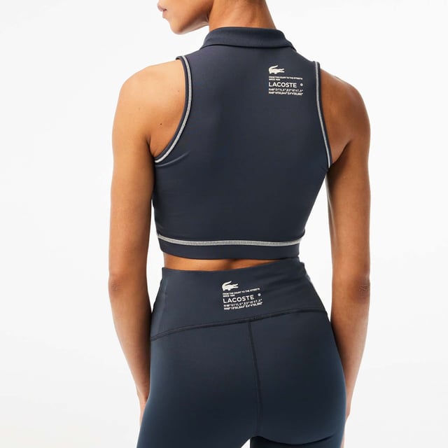 Women's Lacoste Sport Polo Style Sports Bra.- Tight, close-fitting cut: Perfect for any sport.- Ribbed collar: A classic Lacoste finish detail.- Interlock fabric: Hard-wearing and absorbent.- Silicone crocodile badge: Iconic. Material: 85% Polyester, 15% Elastane. Ref: IF4913KXE.