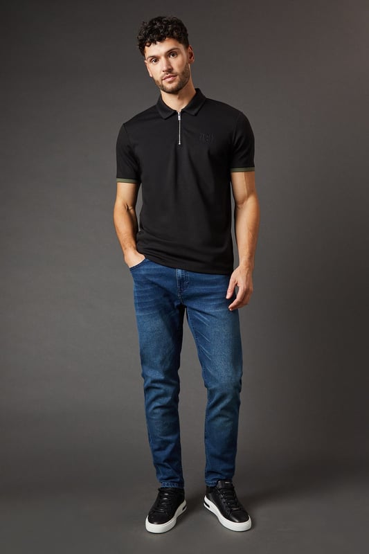 Slim fit design for a modern, tailored silhouette
        Stretch fabric for enhanced comfort and flexibility
        Classic five-pocket styling
        Belt loops for versatile accessorising
        Subtle contrast stitching for added visual interest
    
    These Burton slim fit jeans are the perfect addition to any modern gent's wardrobe. Crafted with a stretch fabric, they offer unparalleled comfort without compromising on style. The slim fit cut creates a sleek silhouette that's ideal for both casual outings and smart-casual occasions. Pair them with a crisp white shirt and blazer for a refined pub lunch, or dress them down with a polo shirt for a relaxed weekend look. The versatility of these jeans makes them a go-to choice for family gatherings, casual Fridays at the office, or watching the match with mates. Their timeless design ensures they'll remain a staple in your wardrobe for seasons to come, offering both style and practicality for the discerning 30-something who values classic appeal over fleeting trends.