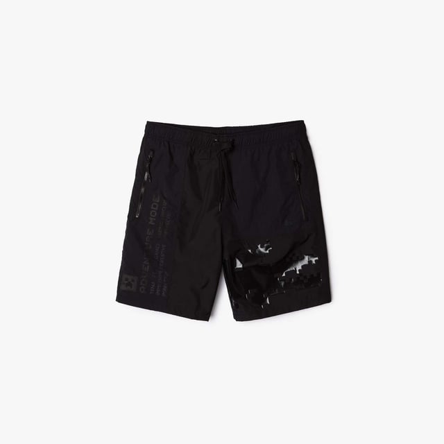 Unisex Lacoste x Minecraft Nylon Bermuda Shorts in Black Unisex Lacoste L!VE x Minecraft Nylon Bermuda Shorts.- Regular fit.- Responsible and water-resistant fabrics.- Four zip pockets, elasticised waistband with branded drawstring.- Matte and shiny Lacoste and Minecraft prints.- Tone-on-tone silicone crocodile on chest. Material: 100% Polyamide. Ref: FH5981031.