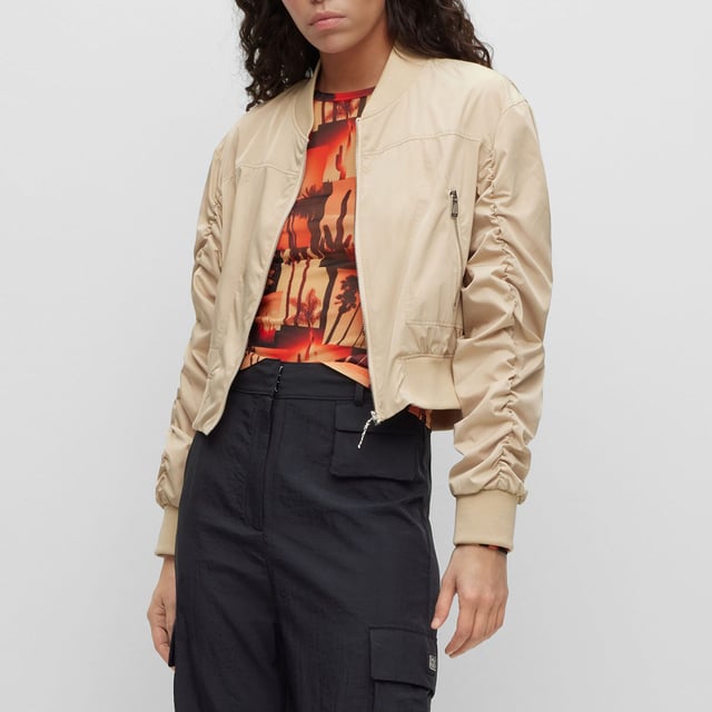 bomber jacket - cropped - round shoulder - zip closure - zip pockets - rib crew neck and rib cuffs - rushing on sleeves - contrast lining - satin - HUGO rivet detail - main material: 100% polyester - lining: 100% polyester - rib: 98% polyester  2% elastane - machine washable.