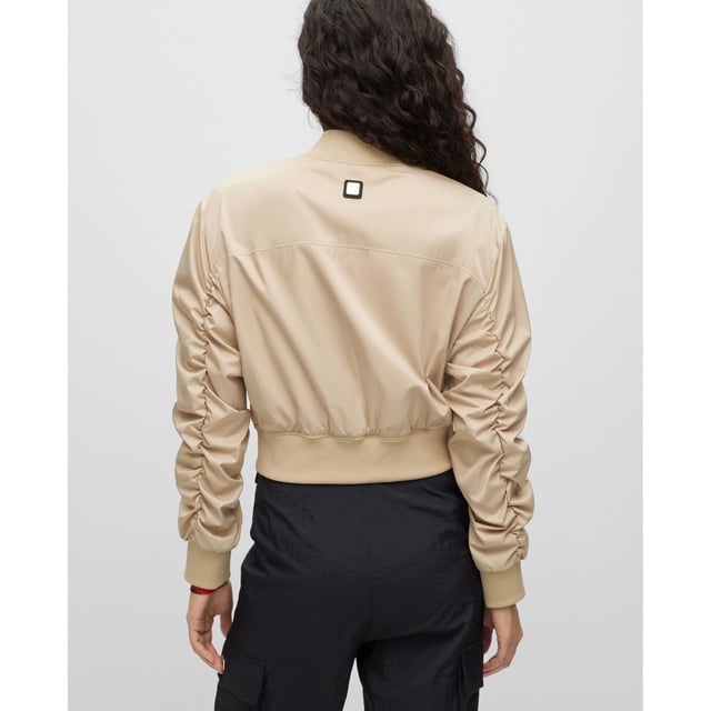 bomber jacket - cropped - round shoulder - zip closure - zip pockets - rib crew neck and rib cuffs - rushing on sleeves - contrast lining - satin - HUGO rivet detail - main material: 100% polyester - lining: 100% polyester - rib: 98% polyester  2% elastane - machine washable.