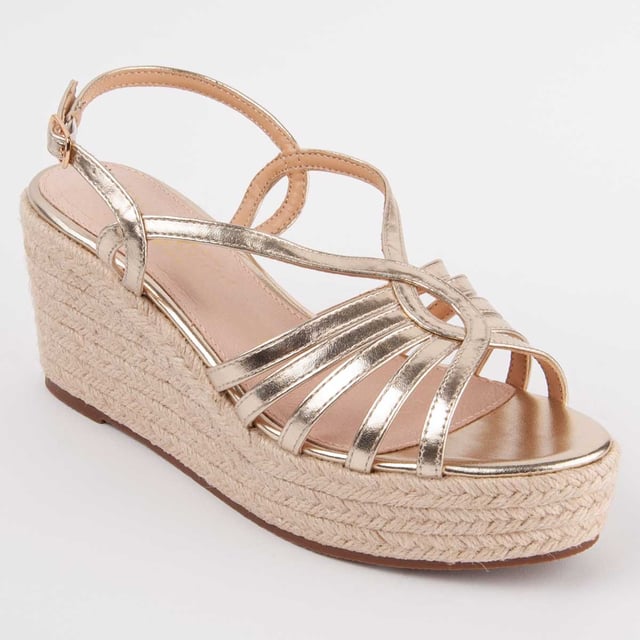 Sandalia de cuña de esparto para mujer. Plantilla de piel 100% natural. Calce cómodo. Fabricado por otras marcas para nuestra marca. Medidas aproximadas: 8 cm de cuña y 3 cm de plataforma.