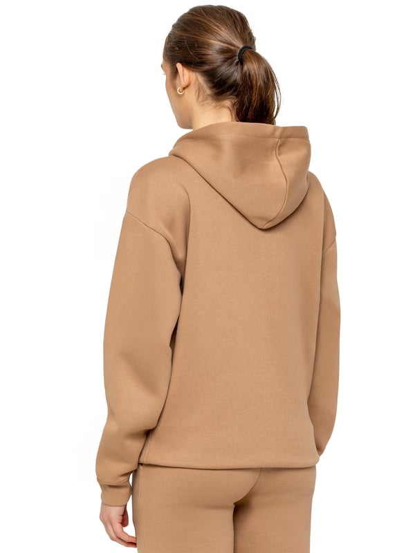 The Enzo Women's Zipped Hoodie boasts an oversized fit with a convenient zip-up design and adjustable drawstring hoodie. The cuffed wrists and brushed back inner fleece ensure maximum comfort, making it the perfect choice for casual wea