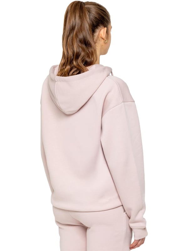 The Enzo Women's Zipped Hoodie boasts an oversized fit with a convenient zip-up design and adjustable drawstring hoodie. The cuffed wrists and brushed back inner fleece ensure maximum comfort, making it the perfect choice for casual wea