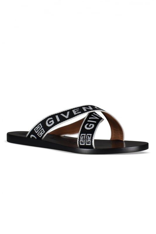 Sandalias de cuero negro Givenchy.Logotipo en la suela y las correas.Tacones bajos y planos con tiras de tela.Made in Italy.