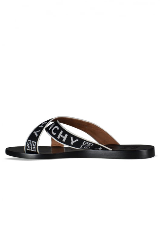 Sandalias de cuero negro Givenchy.Logotipo en la suela y las correas.Tacones bajos y planos con tiras de tela.Made in Italy.