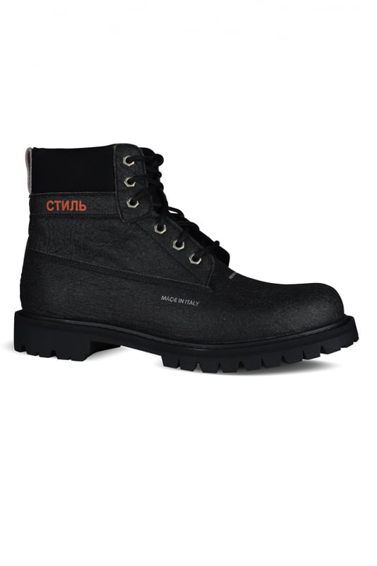 Schwarze Stiefeletten von Heron Preston.Schnürverschluss.СТИЛЬ-Aufdruck in Orange.Gummisohle.80 % Kunstleder, 20 % Polyamid.