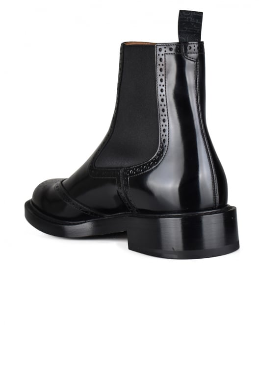 Dior Evidence Chelsea-laarzen van zwart leer.CD-logo op de neus van de schoen.Zwarte elastische banden aan de zijkanten.Tong van zwarte stof aan de achterkant in een slip-on-stijl.Gepolijst kalfsleer met decoratieve perforaties.Leren zool.Gemaakt in Italië.