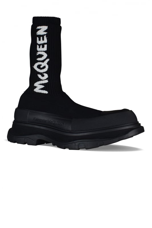 Botas Alexander McQueen Tread Slick.Tejido de punto acanalado negro.Logotipo blanco en contraste.Puntera redonda con inserción de goma negra.Suela de goma negra sobredimensionada con el logotipo de la firma.Made in Italy.
