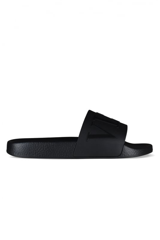 Sandalias Valentino VLTN.Goma negra.Logotipo de la firma  VLTN  en relieve en negro.Suela de goma negra.Made in Italy.