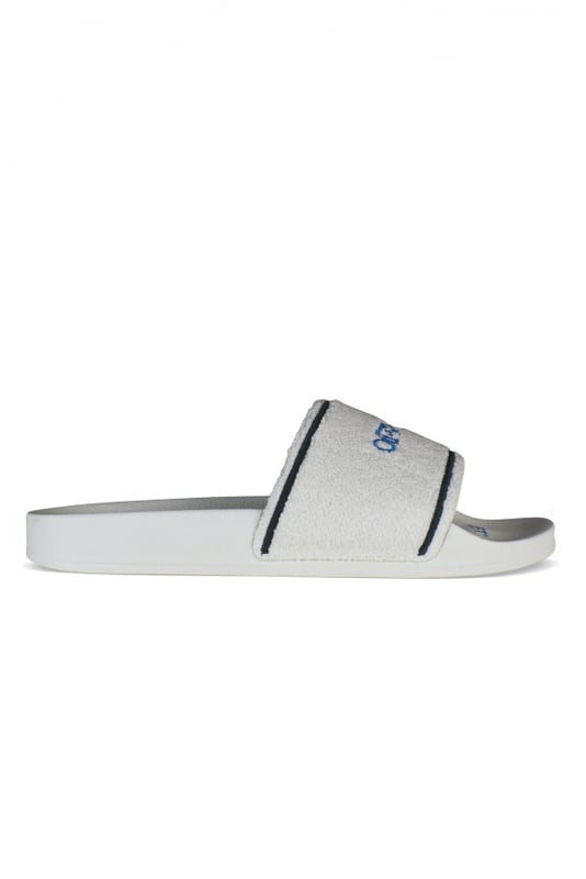 Witte Off-White slippers.In handdoekmateriaal.Blauw geprint logo op de tong.Twee zwarte strepen aan de voorkant. Witte rubberen zool.Gemaakt in Italië.