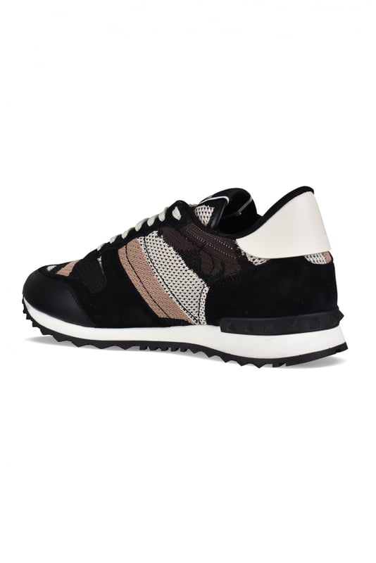 Sneakers de camuflaje Rockrunner de Valentino en negro, blanco y marrón.En ante, piel y lona.Tachuelas de goma decorativas. Contrafuerte de cuero blanco.Suela de goma dentada. Cierre de cordones. Made in Italy.