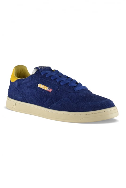 Sneakers bajas Medalist Autry en ante azul.Efecto pelo.Parche con logotipo en el exterior. Contrafuerte de cuero amarillo con logotipo en relieve.Lengüeta con parche del logotipo.Suela de goma con efecto amarilleado.  Cierre de cordones azul. Puntera redonda perforada.