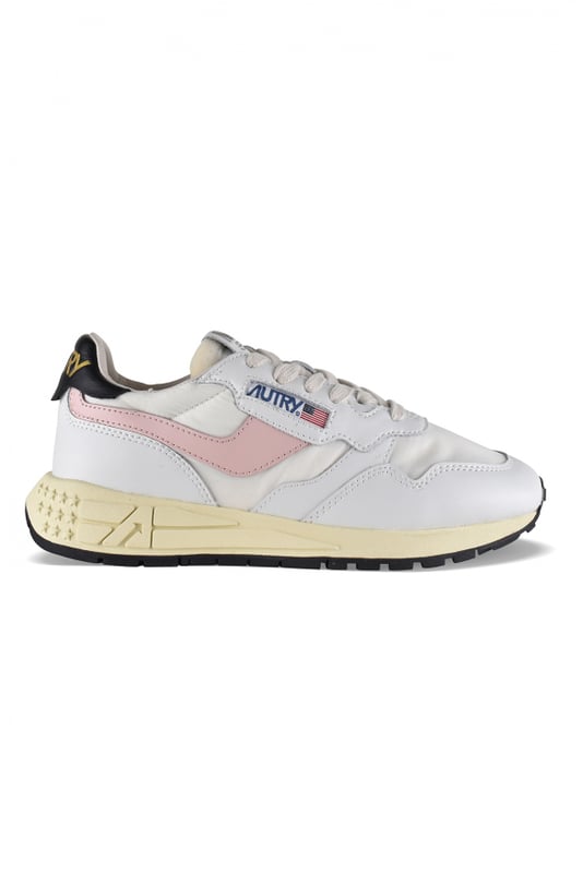 Sneakers bajas Reelwind Autry de nailon y piel en blanco y negro.Parche con logotipo en el exterior. Banda de cuero rosa claro en el exterior. Contrafuerte de cuero negro con logotipo amarillo.Lengüeta con parche del logotipo.Suela de goma con efecto amarilleado y detalles negros.  Cierre con cordones blancos.