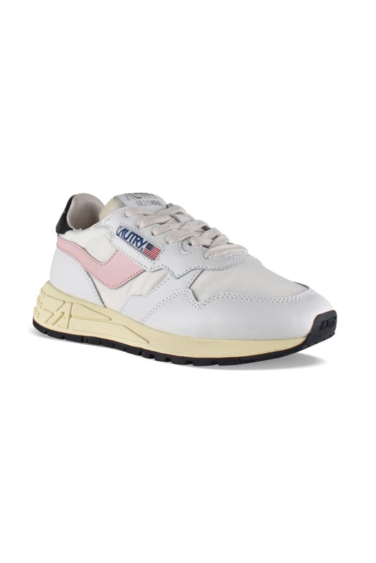 Sneakers bajas Reelwind Autry de nailon y piel en blanco y negro.Parche con logotipo en el exterior. Banda de cuero rosa claro en el exterior. Contrafuerte de cuero negro con logotipo amarillo.Lengüeta con parche del logotipo.Suela de goma con efecto amarilleado y detalles negros.  Cierre con cordones blancos.