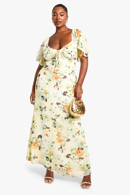 Flowing chiffon maxi dress with eye-catching floral print throughout
        Feminine sweetheart neckline complemented by delicate ruffle detailing
        Flattering short flutter sleeves that add movement and dimension
        Full-length maxi silhouette designed to showcase your curves
        Fully lined for comfort and confidence while maintaining a lightweight feel
    
    Make a statement at your next night out in this captivating plus-size maxi dress from Boohoo. The romantic ruffle detailing and sweetheart neckline create a flattering focal point, while the flowing chiffon fabric moves beautifully with every step. Style with strappy metallic heels and a compact clutch as seen on our model for an effortlessly chic evening ensemble. Perfect for summer cocktails, rooftop parties or dinner dates, this dress transitions seamlessly from day to night with a simple change of accessories. Add delicate jewellery and a lightweight wrap for cooler evenings, or dress it down with flat sandals for daytime gatherings. The versatile print works brilliantly across seasons, making this a wardrobe staple you'll reach for time and again.