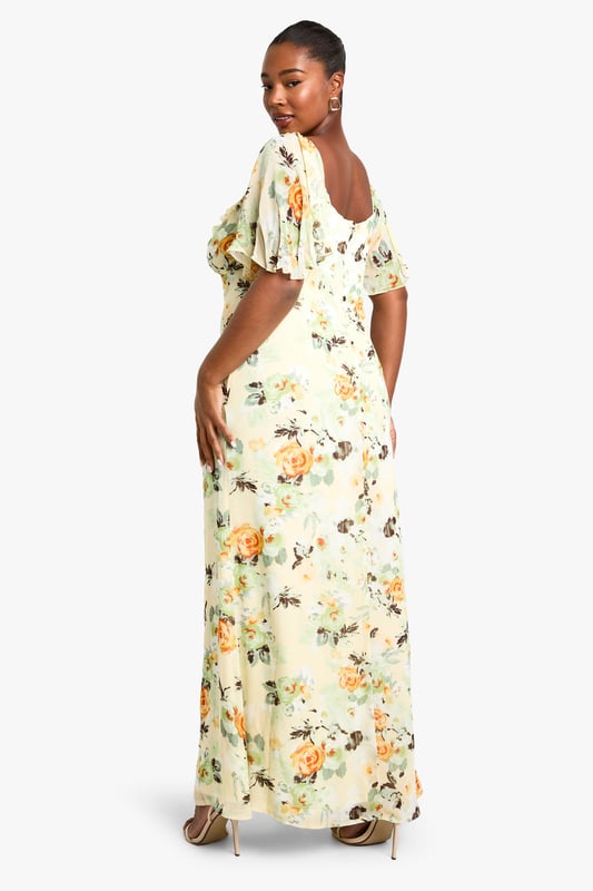 Flowing chiffon maxi dress with eye-catching floral print throughout
        Feminine sweetheart neckline complemented by delicate ruffle detailing
        Flattering short flutter sleeves that add movement and dimension
        Full-length maxi silhouette designed to showcase your curves
        Fully lined for comfort and confidence while maintaining a lightweight feel
    
    Make a statement at your next night out in this captivating plus-size maxi dress from Boohoo. The romantic ruffle detailing and sweetheart neckline create a flattering focal point, while the flowing chiffon fabric moves beautifully with every step. Style with strappy metallic heels and a compact clutch as seen on our model for an effortlessly chic evening ensemble. Perfect for summer cocktails, rooftop parties or dinner dates, this dress transitions seamlessly from day to night with a simple change of accessories. Add delicate jewellery and a lightweight wrap for cooler evenings, or dress it down with flat sandals for daytime gatherings. The versatile print works brilliantly across seasons, making this a wardrobe staple you'll reach for time and again.