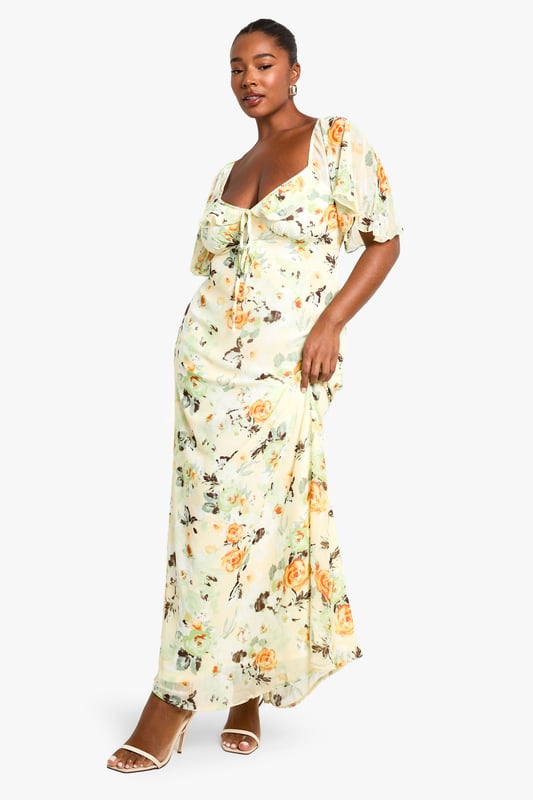 Flowing chiffon maxi dress with eye-catching floral print throughout
        Feminine sweetheart neckline complemented by delicate ruffle detailing
        Flattering short flutter sleeves that add movement and dimension
        Full-length maxi silhouette designed to showcase your curves
        Fully lined for comfort and confidence while maintaining a lightweight feel
    
    Make a statement at your next night out in this captivating plus-size maxi dress from Boohoo. The romantic ruffle detailing and sweetheart neckline create a flattering focal point, while the flowing chiffon fabric moves beautifully with every step. Style with strappy metallic heels and a compact clutch as seen on our model for an effortlessly chic evening ensemble. Perfect for summer cocktails, rooftop parties or dinner dates, this dress transitions seamlessly from day to night with a simple change of accessories. Add delicate jewellery and a lightweight wrap for cooler evenings, or dress it down with flat sandals for daytime gatherings. The versatile print works brilliantly across seasons, making this a wardrobe staple you'll reach for time and again.