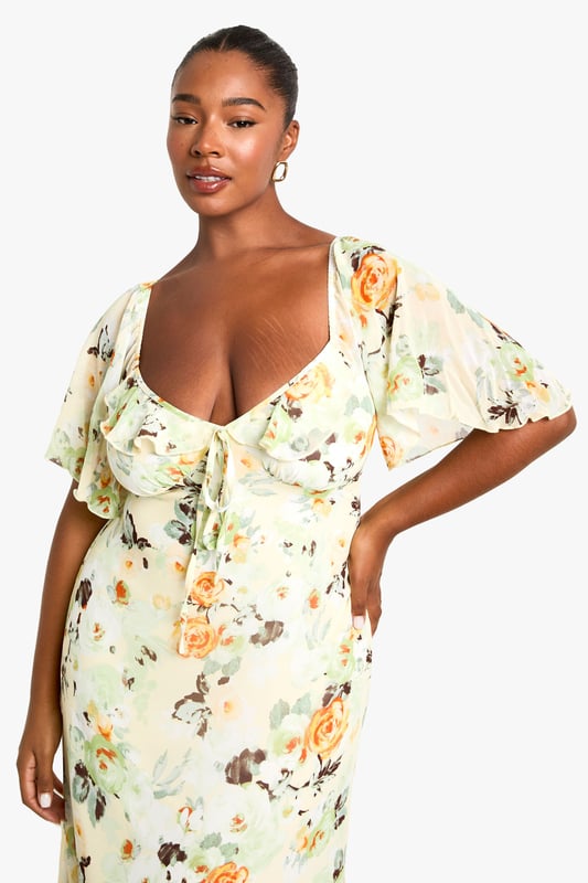 Flowing chiffon maxi dress with eye-catching floral print throughout
        Feminine sweetheart neckline complemented by delicate ruffle detailing
        Flattering short flutter sleeves that add movement and dimension
        Full-length maxi silhouette designed to showcase your curves
        Fully lined for comfort and confidence while maintaining a lightweight feel
    
    Make a statement at your next night out in this captivating plus-size maxi dress from Boohoo. The romantic ruffle detailing and sweetheart neckline create a flattering focal point, while the flowing chiffon fabric moves beautifully with every step. Style with strappy metallic heels and a compact clutch as seen on our model for an effortlessly chic evening ensemble. Perfect for summer cocktails, rooftop parties or dinner dates, this dress transitions seamlessly from day to night with a simple change of accessories. Add delicate jewellery and a lightweight wrap for cooler evenings, or dress it down with flat sandals for daytime gatherings. The versatile print works brilliantly across seasons, making this a wardrobe staple you'll reach for time and again.